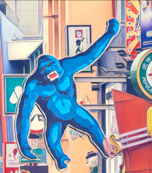 Large blue gorilla sign above a crowded Japanese street; people with backpacks walking below