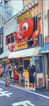 Large red octopus sign with crown above an Osaka takoyaki shop; lanterns and people on the street.
